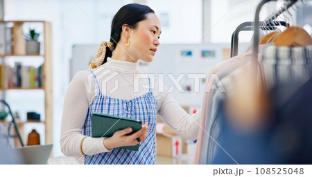 Fashion, worker and Asian woman with a tablet, retail and inventory with ecommerce, connection and small business. Person, shop assistant or worker with technology, checking stock and online shopping Fashion, worker and Asian woman with a tablet, retail and inventory with ecommerce, connection and small business. Person, shop assistant or worker with technology, checking stock and online shopping 108525048
