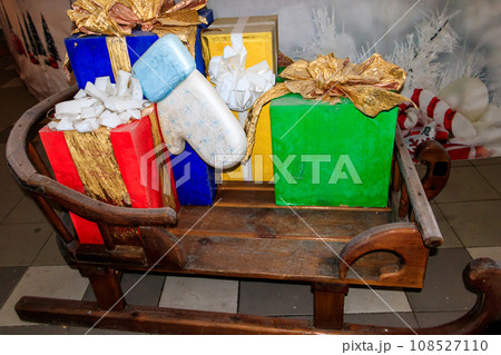 Wooden Santas sleigh with gift boxes 108527110
