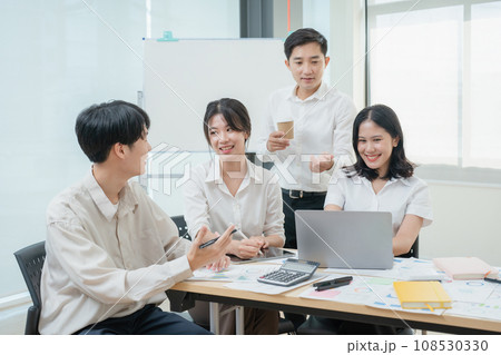 startup Asian business advisor meeting to analyze and discuss the situation on the financial report in the meeting room. 108530330