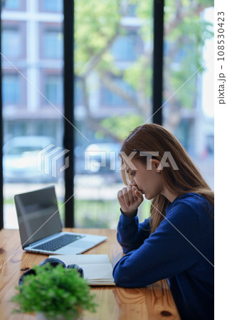 burnout, worried,serious latin girl college student watching distance online learning class, university webinar or having talk on laptop video call and use notebook to virtual meeting at living room burnout, worried,serious latin girl college student watching distance online learning class, university webinar or having talk on laptop video call and use notebook to virtual meeting at living room 108530423