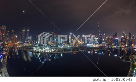 Aerial view to Dubai Business Bay and Downtown with the various skyscrapers and towers night timelapse Aerial view to Dubai Business Bay and Downtown with the various skyscrapers and towers night timelapse 108530948