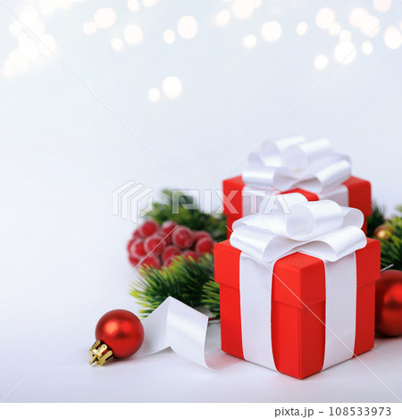 Christmas red gifts with decorations on white background Christmas red gifts with decorations on white background 108533973