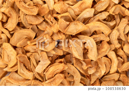 Dried apples or apple chips as an abstract background. 108538630