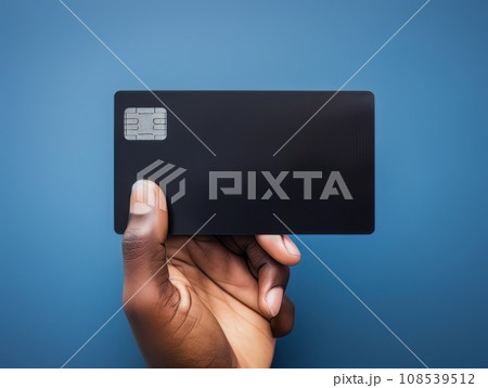 Male hand holding a black bank card on a blue background AI Male hand holding a black bank card on a blue background AI 108539512