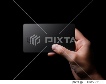 Male hand holding a black bank card on a black background AI 108539556