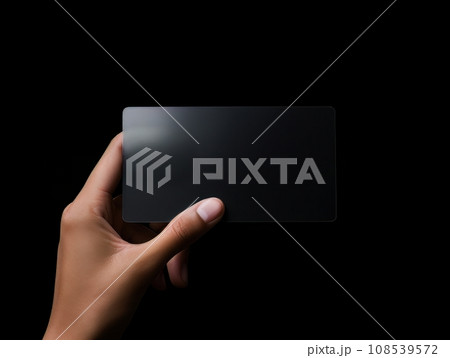Male hand holding a black bank card on a black background AI Male hand holding a black bank card on a black background AI 108539572