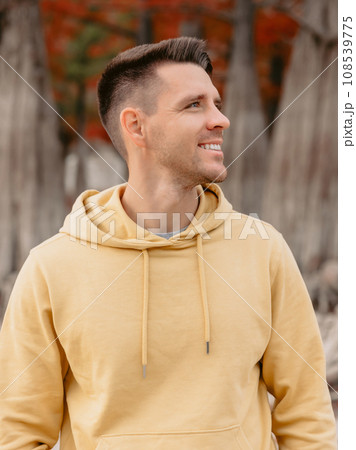 Cute child girl walking and playing in a autumnal forest. Little girl in warm clothes walks in the park Cute child girl walking and playing in a autumnal forest. Little girl in warm clothes walks in the park 108539775