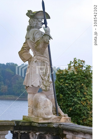 sculpture of a hunter with a dog on the balustrade of Moritzburg castle 108542102