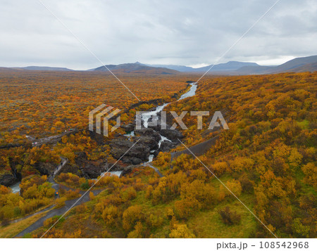 Aerial top view of Hraunfossar waterfall in autumn fall season in Iceland. Famous nature landscape background 108542968