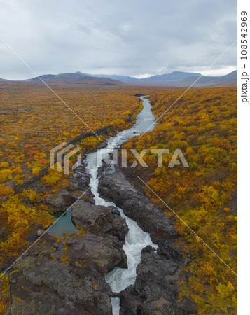 Aerial top view of Hraunfossar waterfall in autumn fall season in Iceland. Famous nature landscape background 108542969