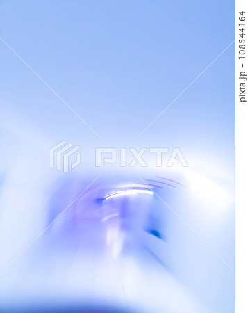Long luminous underground tunnel out of focus background Long luminous underground tunnel out of focus background 108544164
