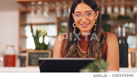 Laptop, freelance and woman in coffee shop with glasses, online research career and smile. Communication, technology and remote work, happy girl in cafe at computer, virtual assistant and reflection. 108545046