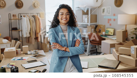 Portrait, business woman and fashion designer with arms crossed in boutique, clothes store or startup. Confidence, happy tailor and professional, entrepreneur and creative worker in glasses in Brazil Portrait, business woman and fashion designer with arms crossed in boutique, clothes store or startup. Confidence, happy tailor and professional, entrepreneur and creative worker in glasses in Brazil 108545355