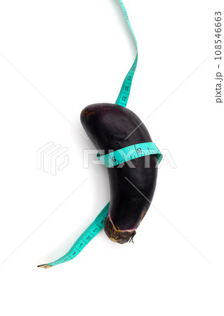 Eggplant with measuring tape on white background. 108546663