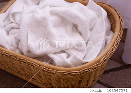 Used towel in a wicker basket. Laundry concept 108547571