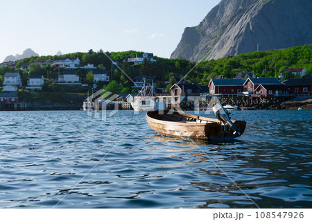 View on the small harbor of fishing village, Summer Lofoten islands, Norway. View on the small harbor of fishing village, Summer Lofoten islands, Norway. 108547926