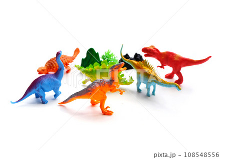Plastic dinosaur toys on white background. Top view Plastic dinosaur toys on white background. Top view 108548556
