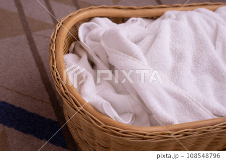Used towel in a wicker basket Used towel in a wicker basket 108548796