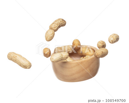 Boiled peanut fly explosion, boiled peanut bean fall down pour in wooden bowl. Tropical boiled peanut throw in air. White background Isolated high speed shutter, freeze action Boiled peanut fly explosion, boiled peanut bean fall down pour in wooden bowl. Tropical boiled peanut throw in air. White background Isolated high speed shutter, freeze action 108549700