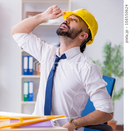 Architect working in his studio on new project 108550624