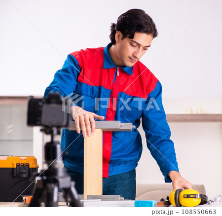 Young contractor recording video for his blog Young contractor recording video for his blog 108550663