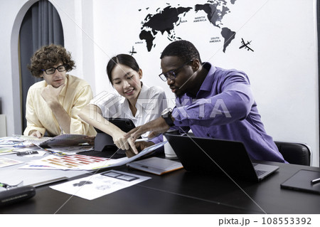 Teamwork architects designers brainstorm modern office an using laptop with blueprint on table. 108553392