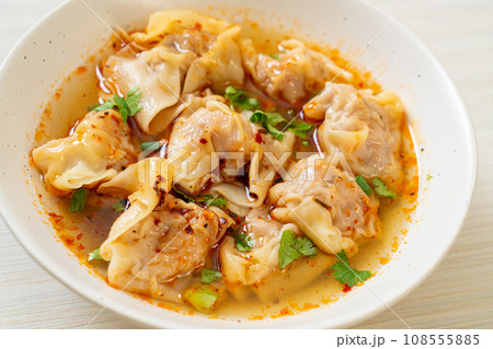pork wonton soup or pork dumplings soup with roasted chili pork wonton soup or pork dumplings soup with roasted chili 108555885