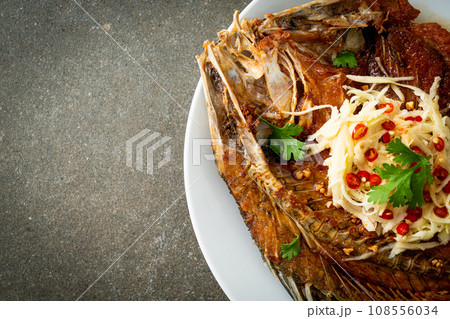 Fried Sea Bass Fish with Fish Sauce and Spicy Salad Fried Sea Bass Fish with Fish Sauce and Spicy Salad 108556034