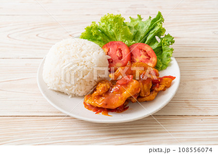 Fried fish topped by 3 flavors chili sauce with rice Fried fish topped by 3 flavors chili sauce with rice 108556074