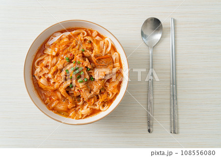 Korean udon ramen noodles with pork in kimchi soup 108556080