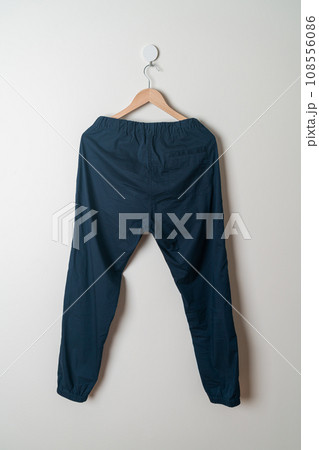 trousers or long pants hanging on wall trousers or long pants hanging on wall 108556086