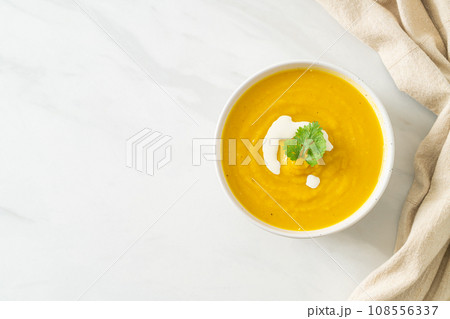pumpkin soup in white bowl 108556337