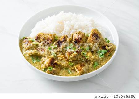 Afghani chicken in green curry or Hariyali tikka chicken hara masala with rice Afghani chicken in green curry or Hariyali tikka chicken hara masala with rice 108556386