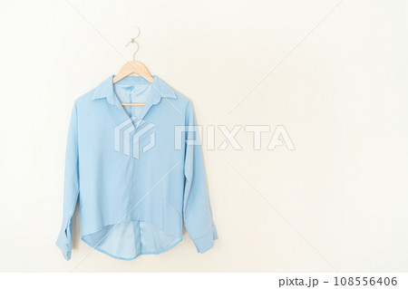 beautiful woman shirt hanging on wall 108556406