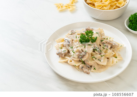 farfalle pasta with mushroom white cream sauce 108556607