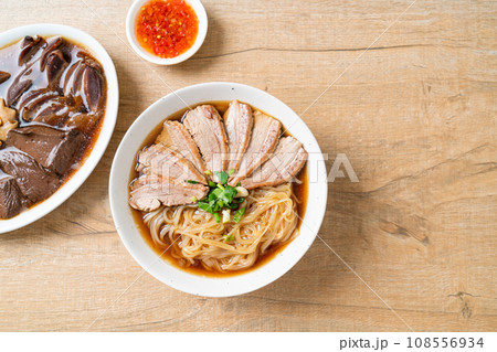 duck noodles with stewed duck soup 108556934