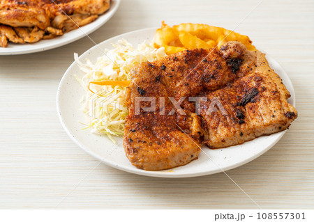 grilled spicy barbecue pork steak with french fries grilled spicy barbecue pork steak with french fries 108557301