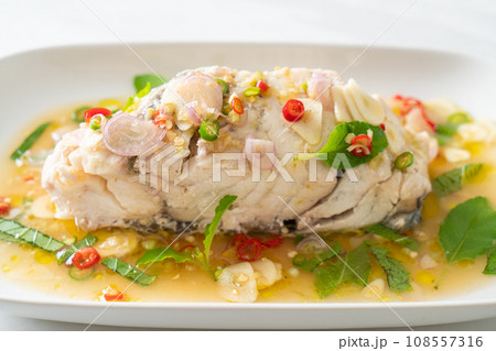 steamed sea bass fish with herbs steamed sea bass fish with herbs 108557316