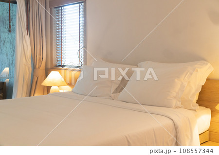 comfortable white pillows on bed 108557344