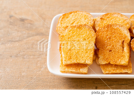 baked crispy bread with butter and sugar baked crispy bread with butter and sugar 108557429