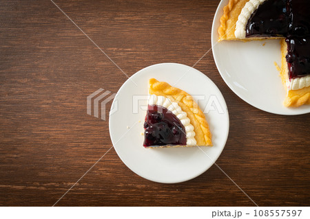 Blueberry Cheese Pie on white plate Blueberry Cheese Pie on white plate 108557597