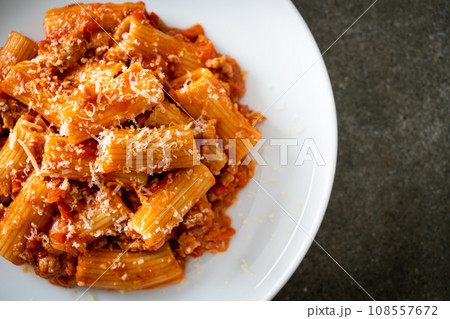 Rigatoni pasta bolognese with cheese Rigatoni pasta bolognese with cheese 108557672