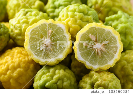 Kaffir lime fruit background, Organic ingredients in Thai cuisne, beauty and cosmetics Kaffir lime fruit background, Organic ingredients in Thai cuisne, beauty and cosmetics 108560384