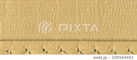 Brown and beige colored corrugated cardboard detail 108564482