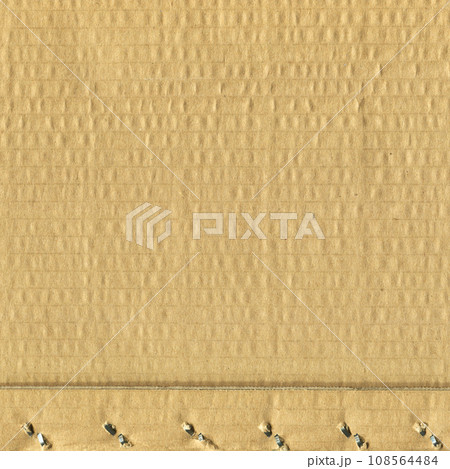 Brown and beige colored corrugated cardboard detail 108564484