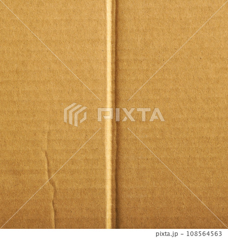 Brown and beige colored corrugated cardboard detail 108564563