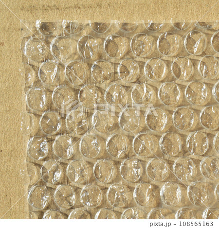 On corrugated cardboard paper plastic air bubble protection foil wrap texture background 108565163