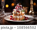 christmas cake with berries and cream night bokeh background 108566502
