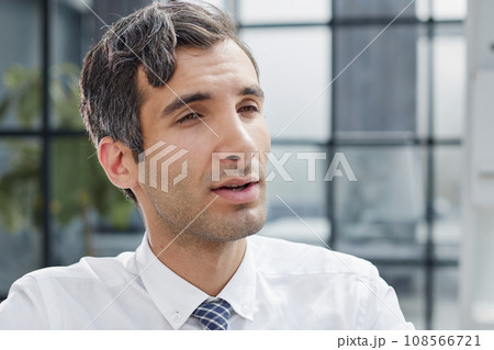 Confident and focused young designer standing in an office Confident and focused young designer standing in an office 108566721