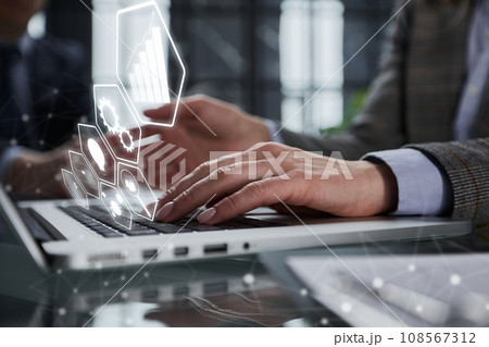 man's hands typing on laptop keyboard in interior man's hands typing on laptop keyboard in interior 108567312